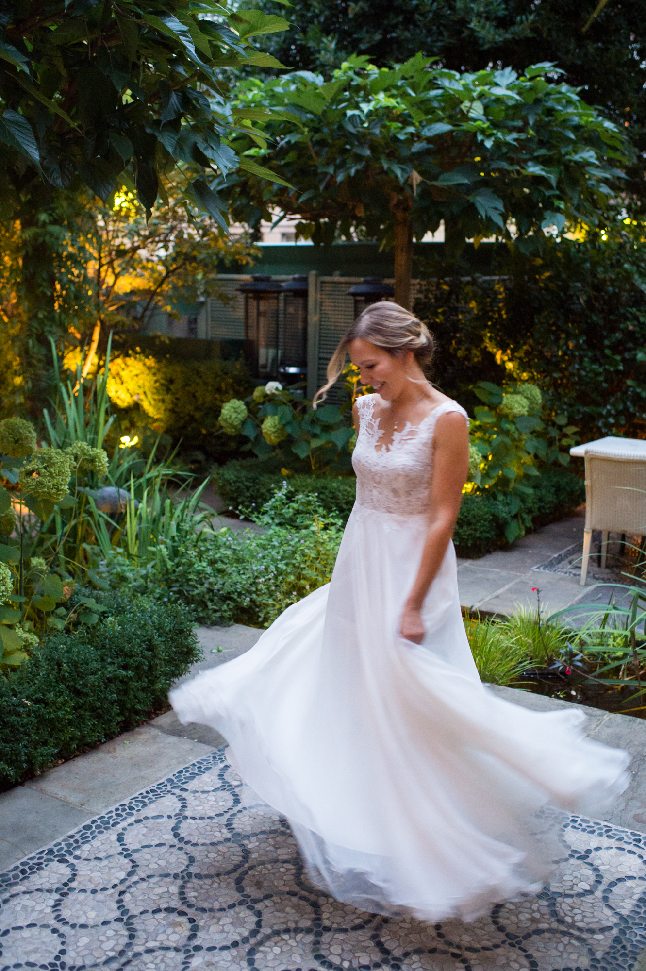 A bride twirling around in the Firmdale hotel, Number Sixteen garden